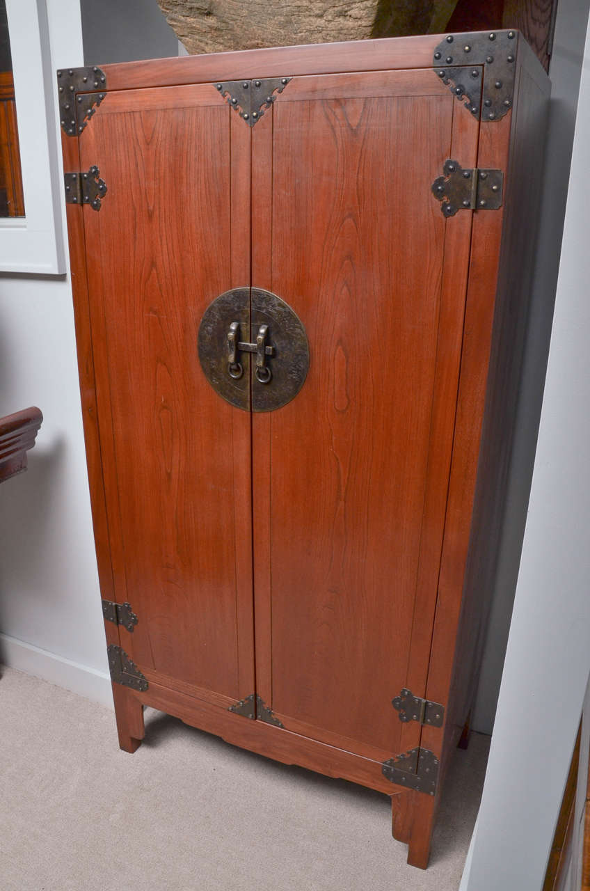 Turn of the century Qing dynasty Bobble head nail studded scholar's cabinet.