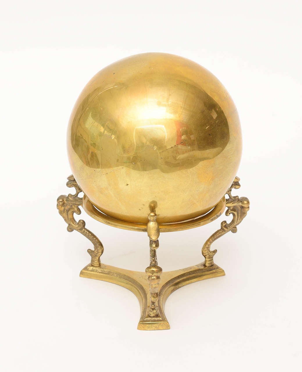This period delightful and rich looking decorative object for a desk or cocktail table has a bright polished brass ball that sites in a seahorse adorned stand. Looks like a crystal ball in brass!!!

NOTE: THIS WILL BE ON THE SATURDAY SALE FOR 1