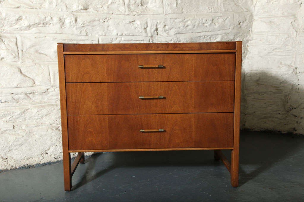 A handsome bachelor's 3-drawer chest by Drexel from the Panorama line. Made of solid walnut with walnut/brass handles.