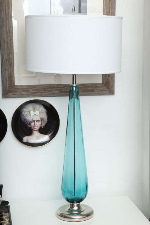 A tall Murano glass lamp with a chrome base and chrome finial.  Rewired, replated and with a new white linen shade.
