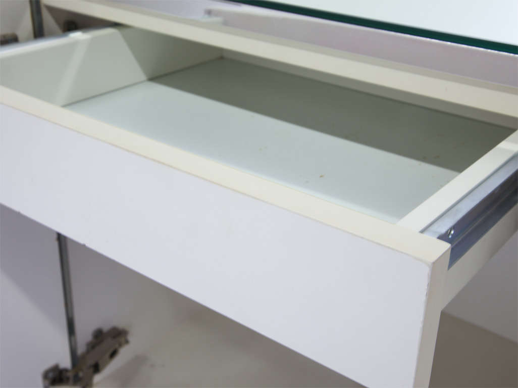 Console with mirrored front panels and chrome accents.