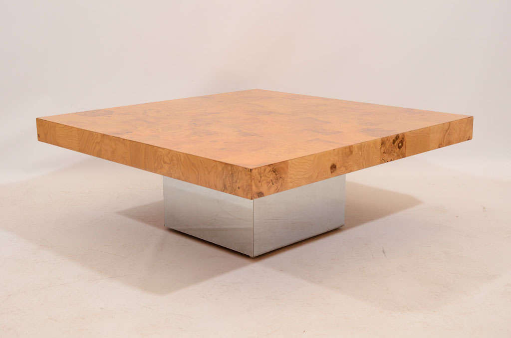 Beautiful coffee table finished in a patchwork of burl wood veneer and floating on a chromed cube base. Designed by Milo Baughman for Thayer Coggin. Located in Las Venus at ABC Home, 646-602-3519.