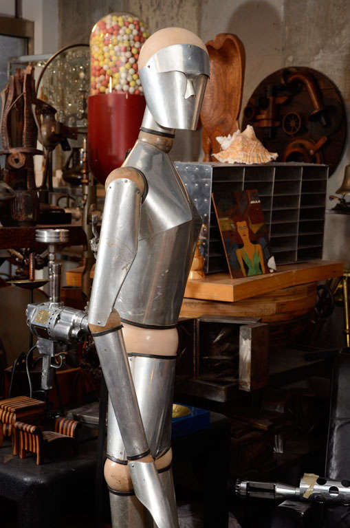 This is one of the best life size articulated figures we have ever had. It is wood an steel and every part of the body is articulated. It is French 1960's and comes with a custom stand.