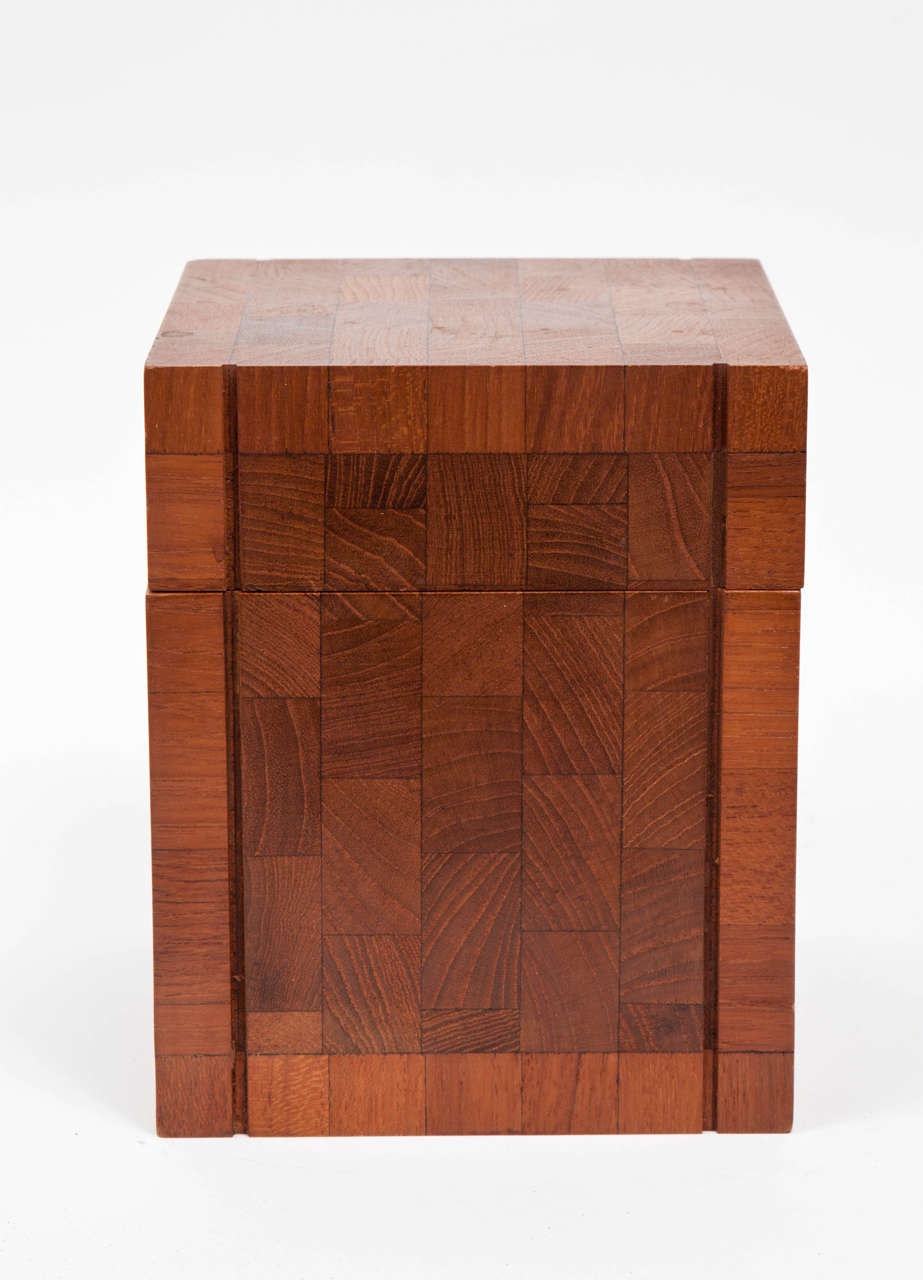 Teak humidor with removable cover by Dunhill. Designed to hold cigars. Made in British Colonial Hong Kong. Signed. Features a cross-check veneer pattern complemented by vertical grooves on two sides.