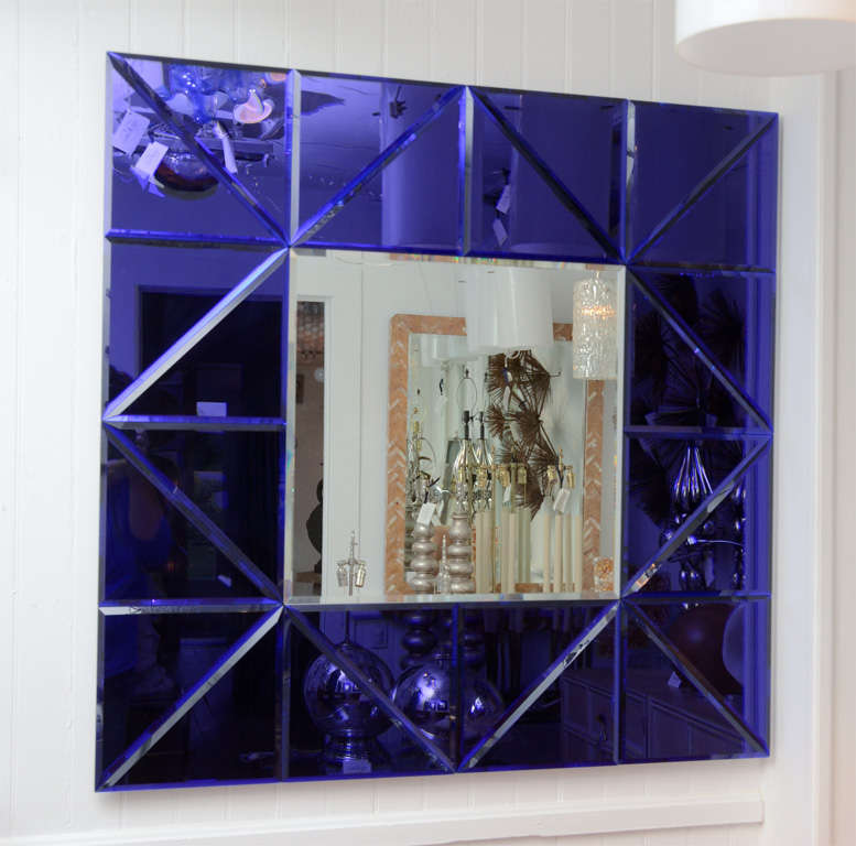 Sapphire blue triangle glass tile surround framed mirror.