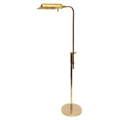 A 1950's American Modern Futurist brass Reading Lamp