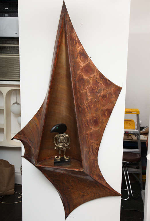 A 1970s Architectural patinated copper wall sculpture with shelf.