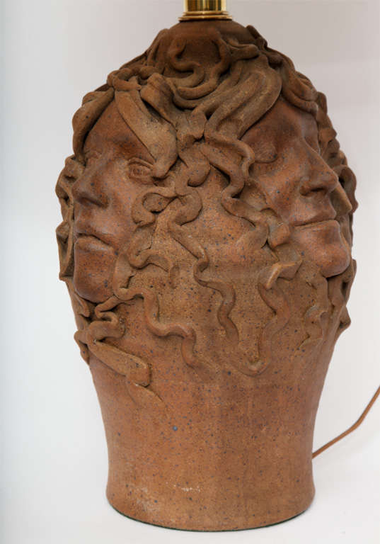 The sculptural form crafted of ceramic with woman’s faces in relief 1970's
Shade not included