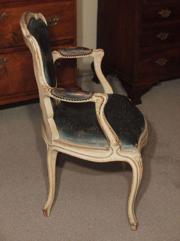 Antique French blue leather games table w/four armchairs. 6