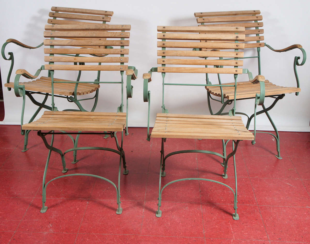 French bistro style folding teak and metal arm chairs made for indoor or outdoor use, excellent solid condition.
Arm height: 28.75
