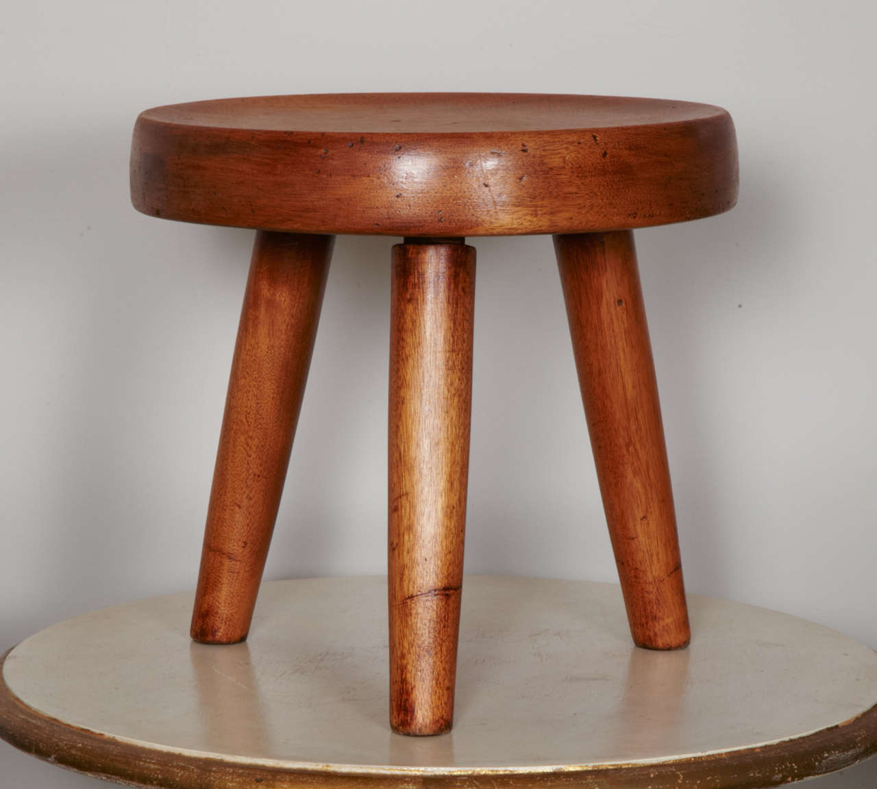stool in blond mahogany by Charlotte Perriand