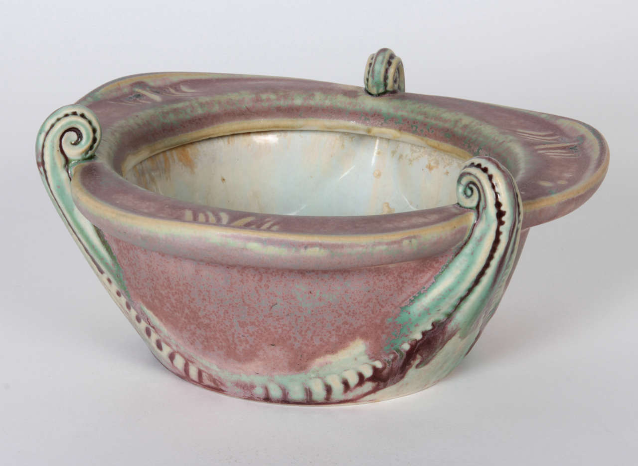 LOUIS MAJORELLE    (1859-1926)  France
MOUGIN FRÈRES  Nancy, France

Fiddleback Fern trefoil bowl    c. 1900

A rare stoneware example of Majorelle and the L’Ecole de Nancy with a mauve and sea-green glaze, crystalline formations in interior in