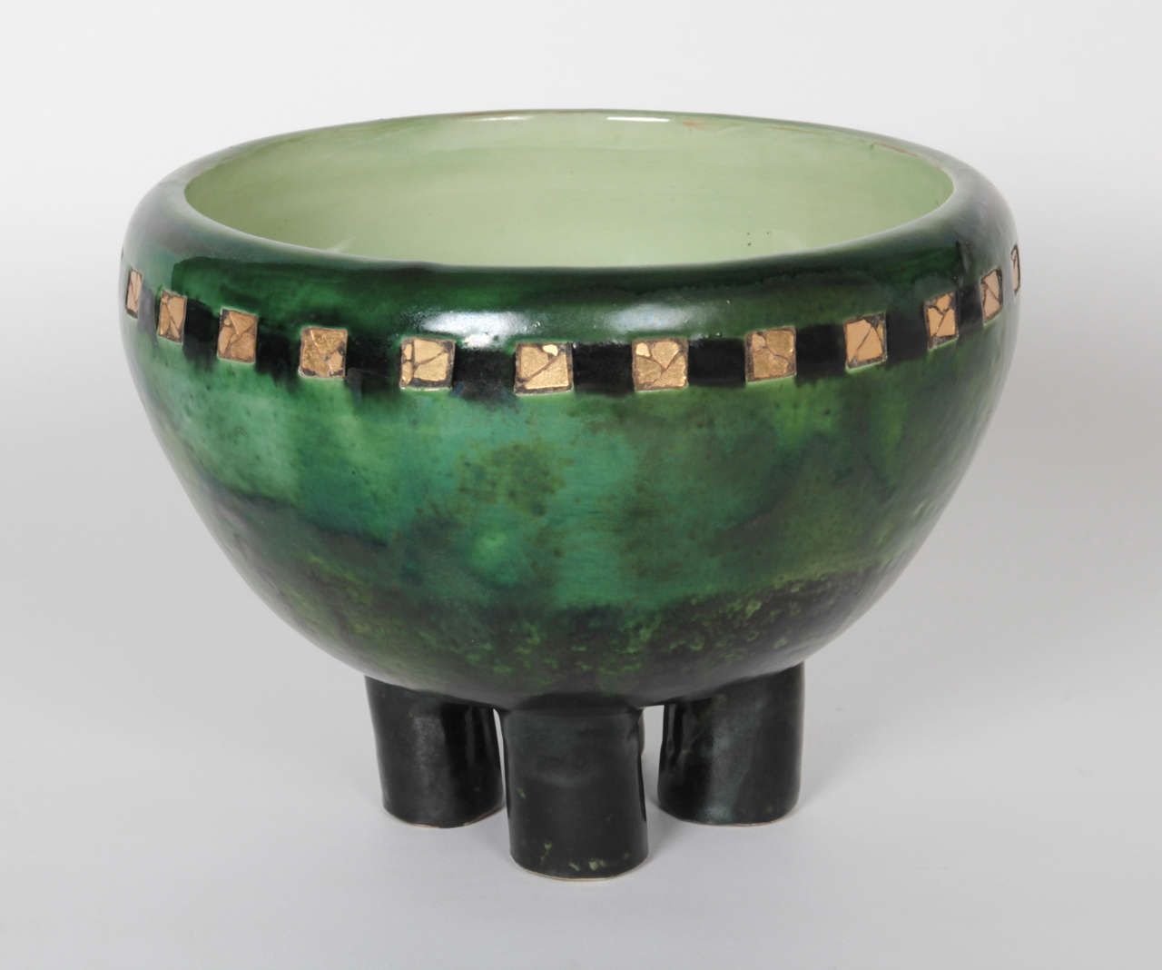 PROF. MAX LÄUGER  (1864-1952)  Karlsruhe, Germany

Unique Jugendstil ceramic footed bowl inlaid with gold mosaic 1906

Light and dark green glazed earthenware inlaid with mosaic gold glass squares on four cylindrical feet.

Marks: ML, K