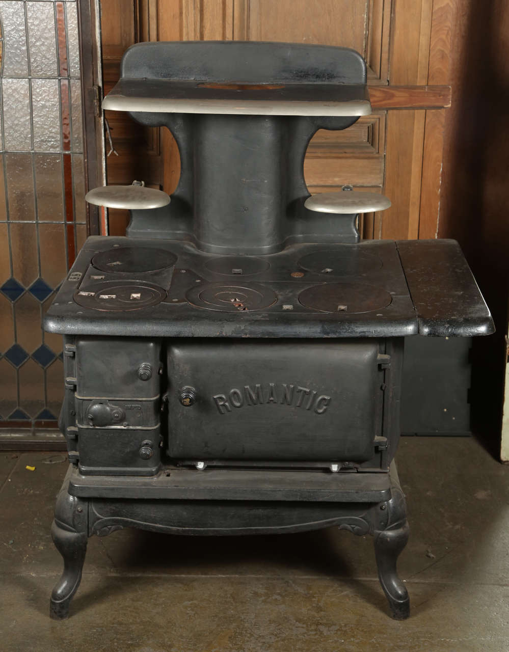 This is a turn of the century coal and wood burning stove. Unusual in that most were made to either burn wood or coal. That was a high end model at the time. Still usable for baking, cooking, etc.