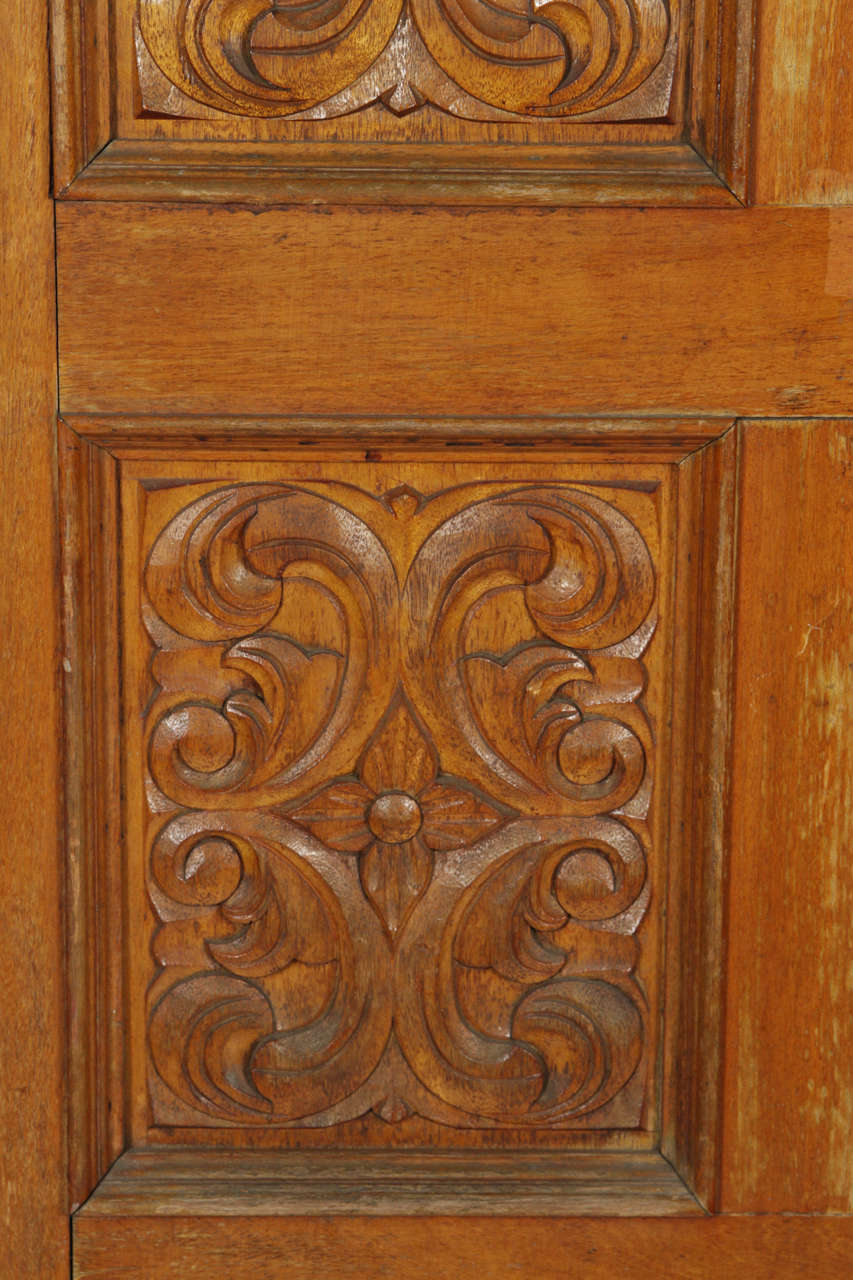 Carved Wooden Spanish Style Entry Door with Bronze Doorknocker at