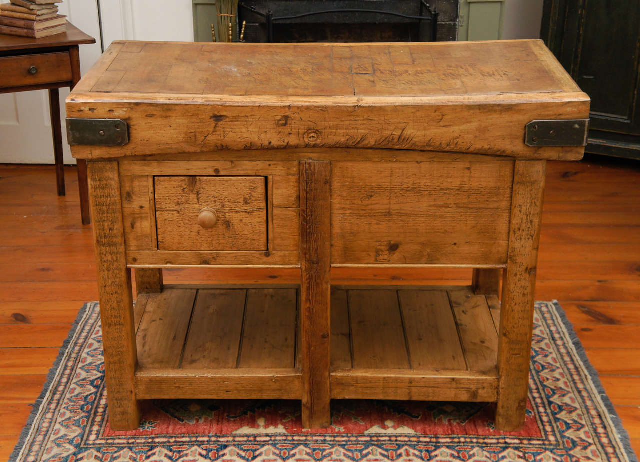 This Butcher block is as nice a top as we have ever found. Original straps and the worn perfectly, to show that it is both old and still very useable. The base was designed by Painted Porch to fit the top from old wood, perfectly matching the wear