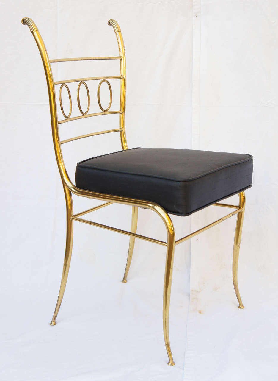 the frame of this chair is simply gorgeous. Italian.
the seat is all wrong.
Remove the original black seat and give it an elegant tufted seat in a champaign raw silk. And some tufting. Curve the seat to follow the front legs. We can have it all