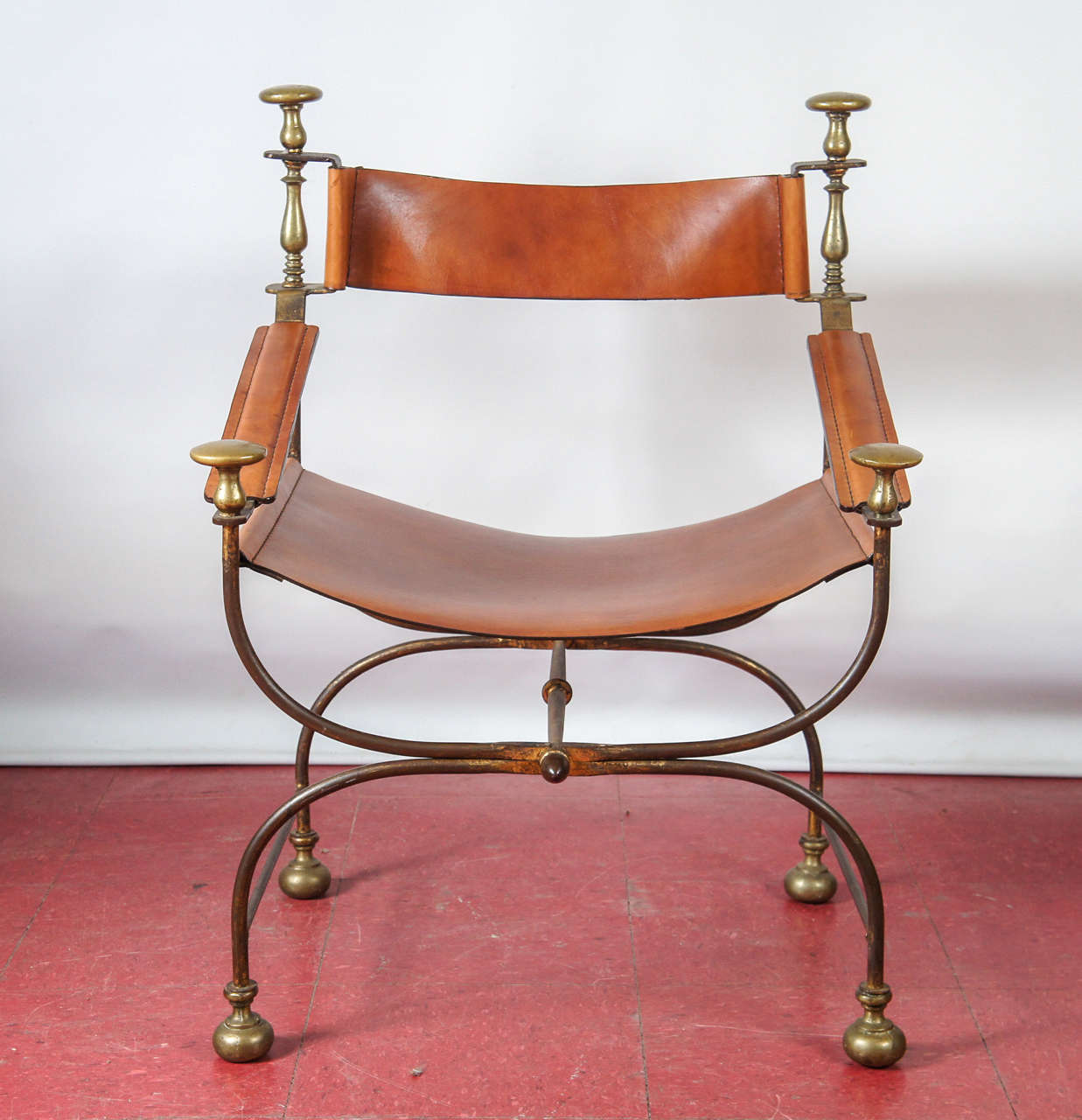 Baroque style steel, brass parcel gilt and leather chair.