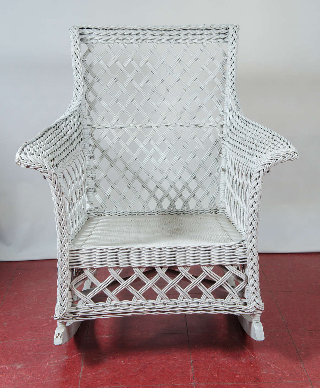 Split reed rattan rocking chair very well constructed with white basket and lattice weave. 23.5