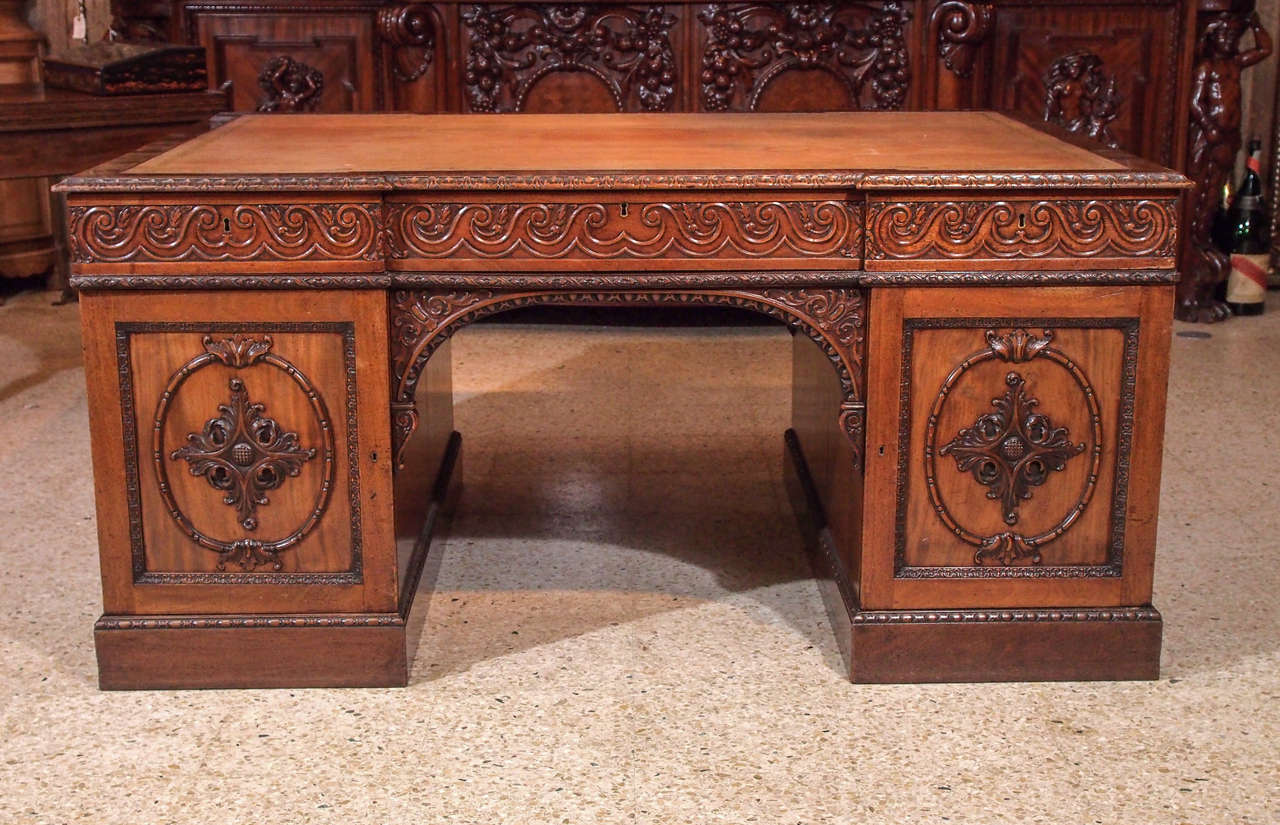 Antique English carved walnut pedestal desk, circa 1880-1890. Exceptional quality.
