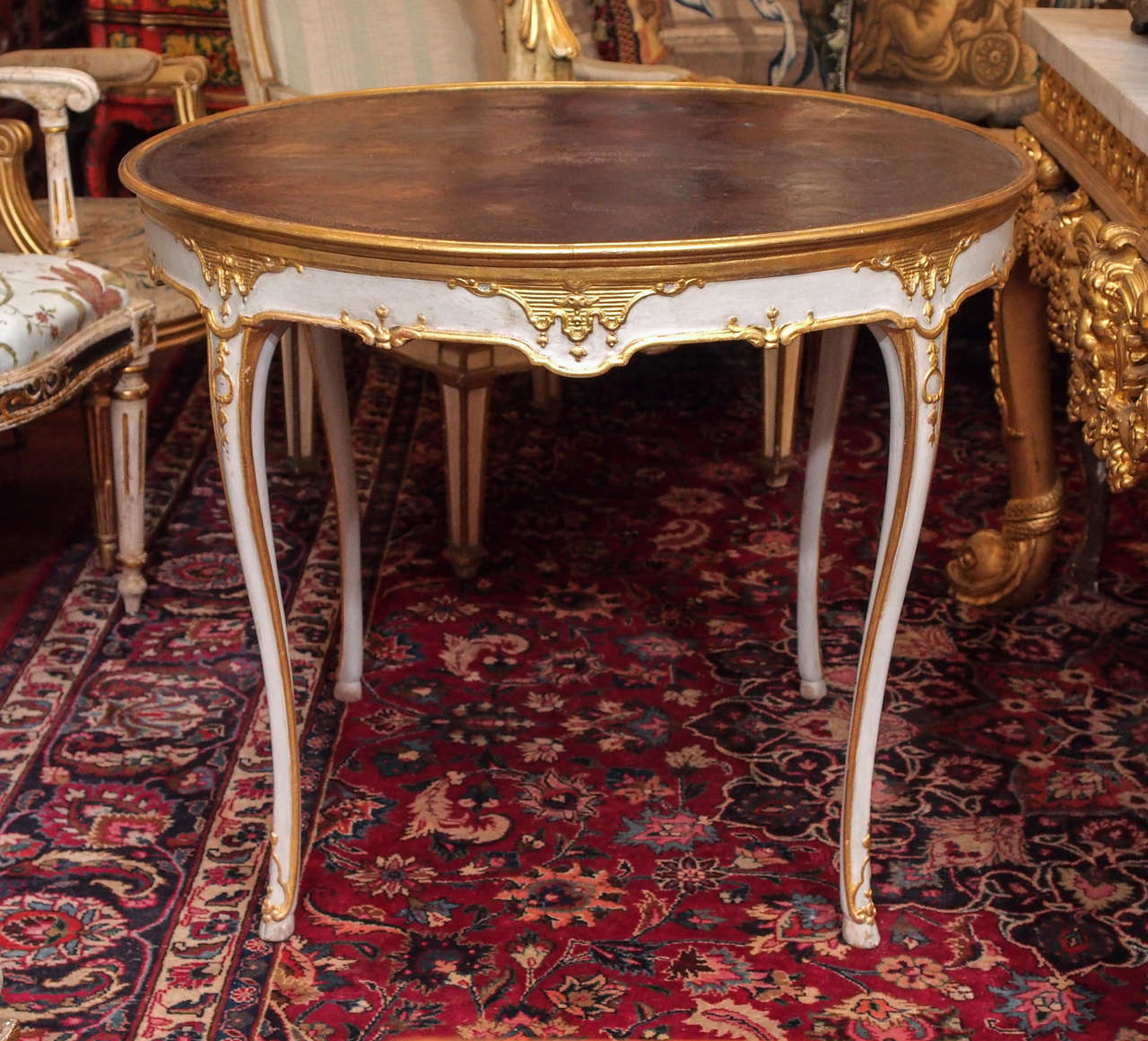Italian Louis XV Tooled Leather Topped Painted and Parcel Gilt Round Table