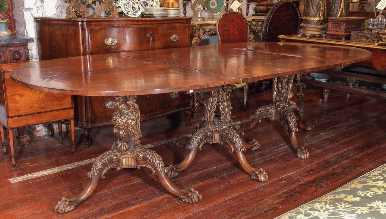 19th C. English Three Pedestal Dining Table with silver gilt eagle motif on the two outer pedestals and a foliate pierced design center pedestal. The table has Two leaves with all inlay etc from the table that are original. they measure 24