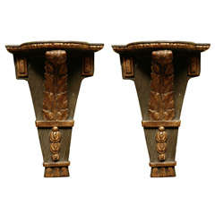 A Pair of Painted and Gilt INeoclassical Brackets