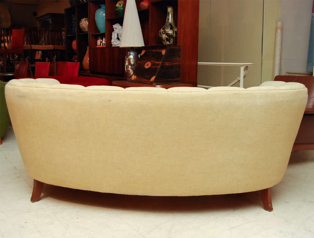 Banana-form sofa with beech legs, oatmeal upholstery with channelled back, mid-century modern from Denmark