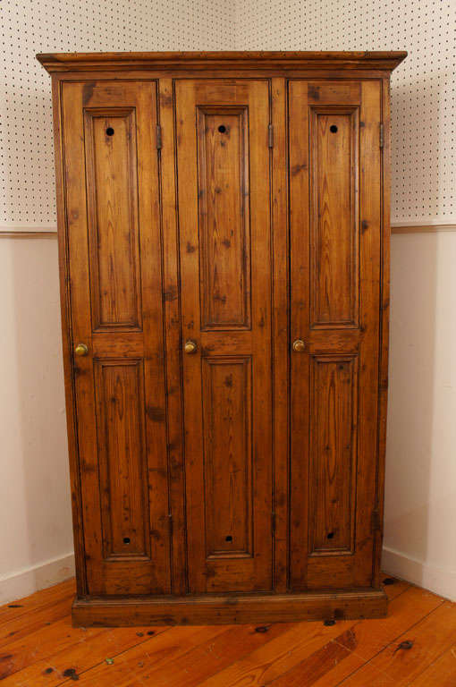 This old golf locker came from a country club in England. it has three wonderful opine paneled doors each with air vents both top and bottom for ventilation. the interior of each locker has a shelf and hook for storing golf clothing and equipment.