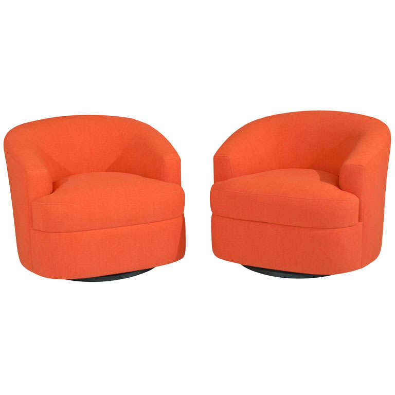 Pair of Orange Swivel Chairs