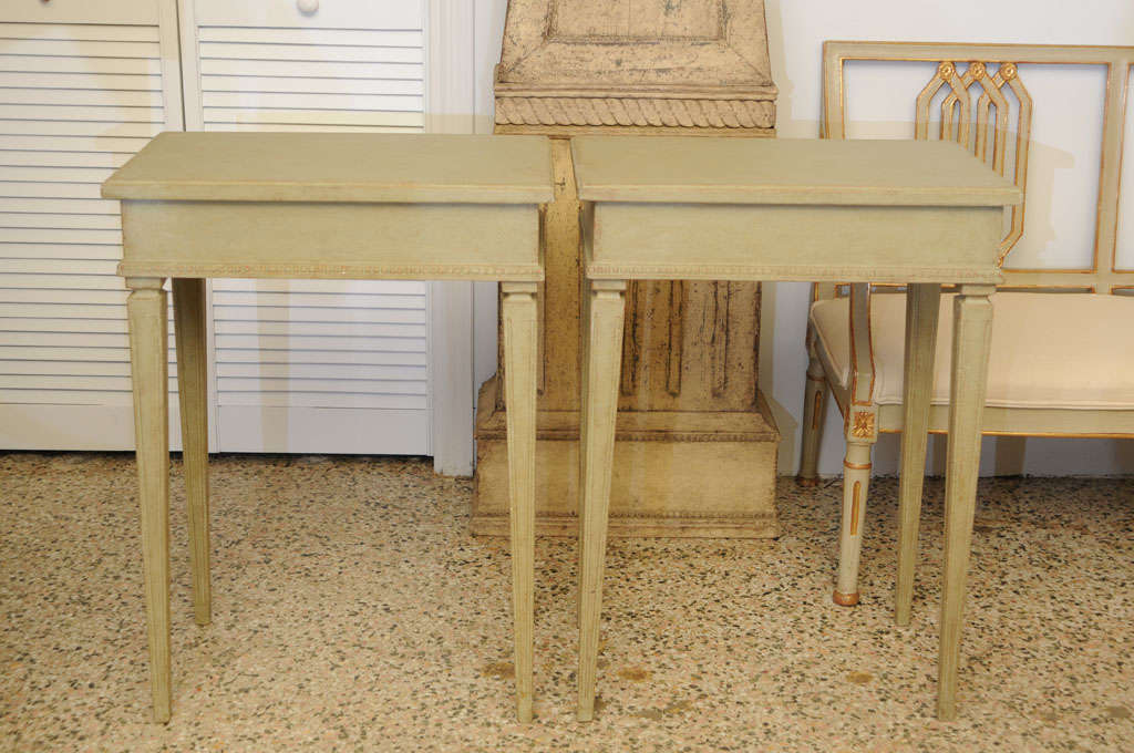 Pair of late 19th Century Gustavian side tables, carved aprons and square tapered legs. Refreshed greenish paint.