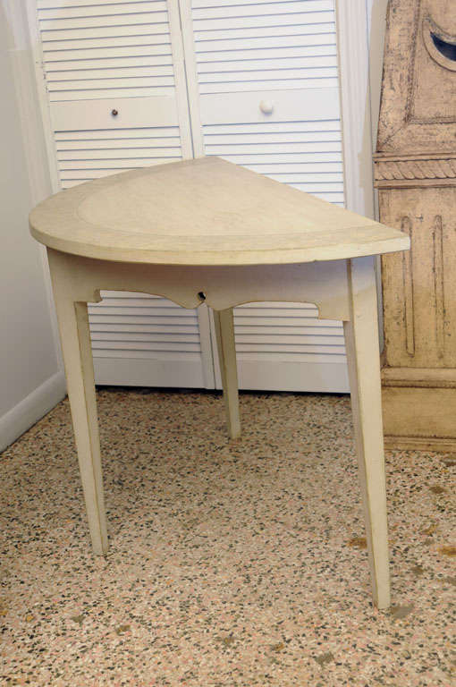 Pair of antique Swedish painted demi lune tables.  With a greenish-gray faux marble border trim on table top and molded border apron trim below;  grey/greenish distressed paint finish.  Simple square tapered legs.

Circa  Early 19th Century

44.00