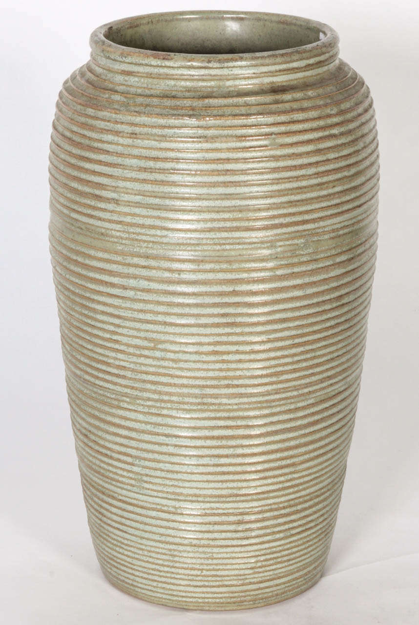 Monochromatic glazed pottery vase with ribbed decoration.
Monmouth pottery, circa 1950.
Large form.