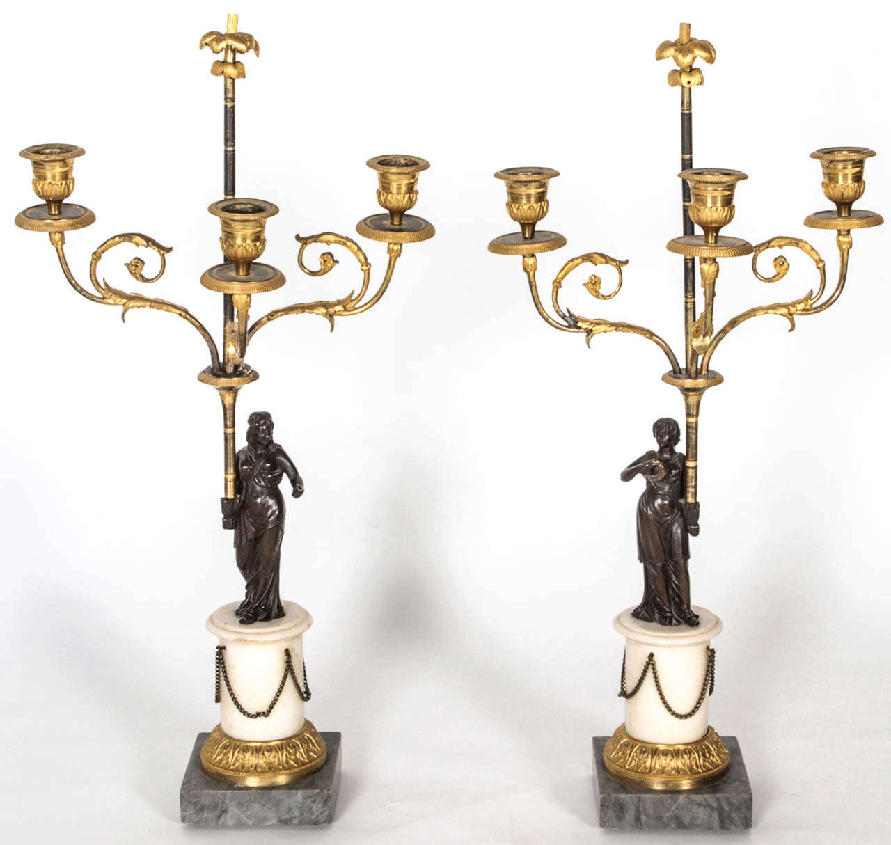 Pair of ormolu gilded and bronze three-armed candelabra.