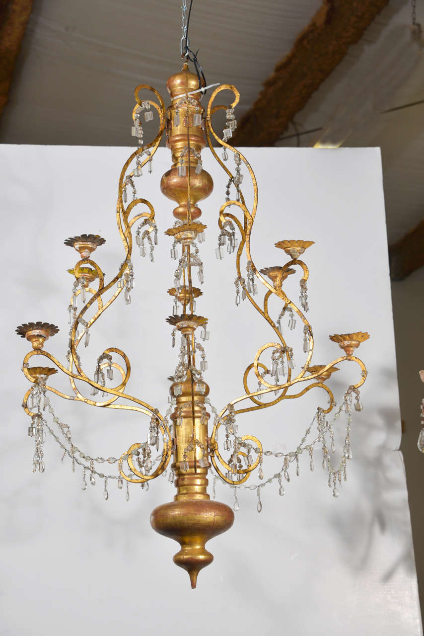 This beautiful 19th century, Italian wood, iron and crystal chandelier is from the quaint City of Lucca in Tuscany. (Chandelier has been newly wired since photo was taken.)