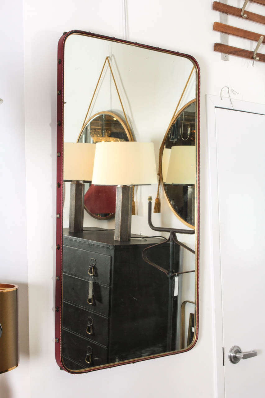 1950's stitched leather mirror by Jacques Adnet