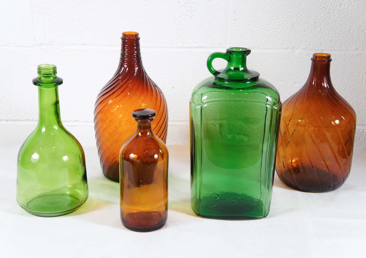Here is a very nice collection of French brown and green glass bottles with great scale and color.