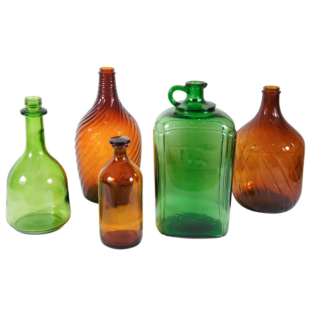 An Assortment of Green and Brown Bottles For Sale