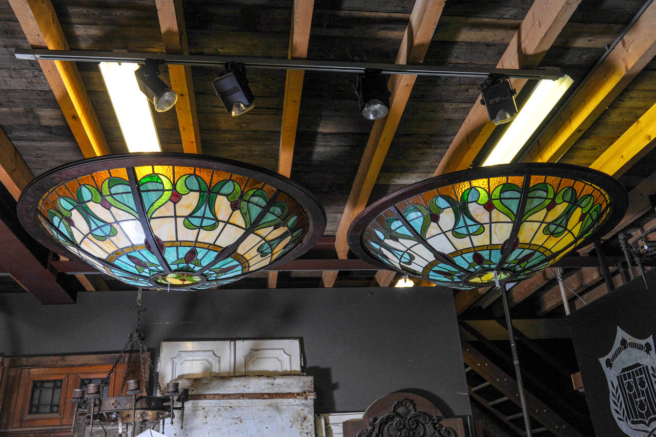 A glass-in-lead Art Nouveau ceiling light. ± 1900. Beautiful hand made glass panels. Slag glass in marbled ockre. The bowl-shaped lights ideal for a bar look.