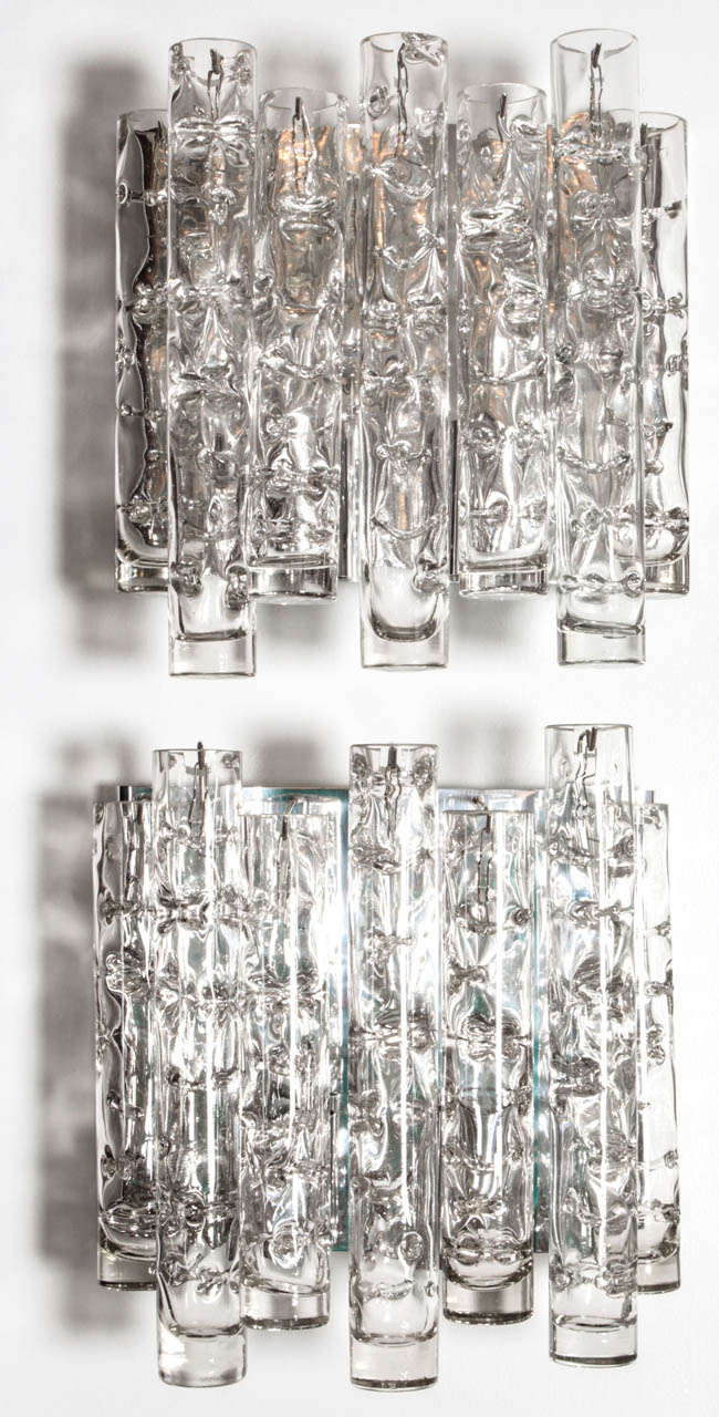 Modernist pair of glass tube sconces by Doria on a polished chrome armature. Each sconce has two sockets. Rewired for use in the USA.

Currently 2 pairs available, $3400 pair.