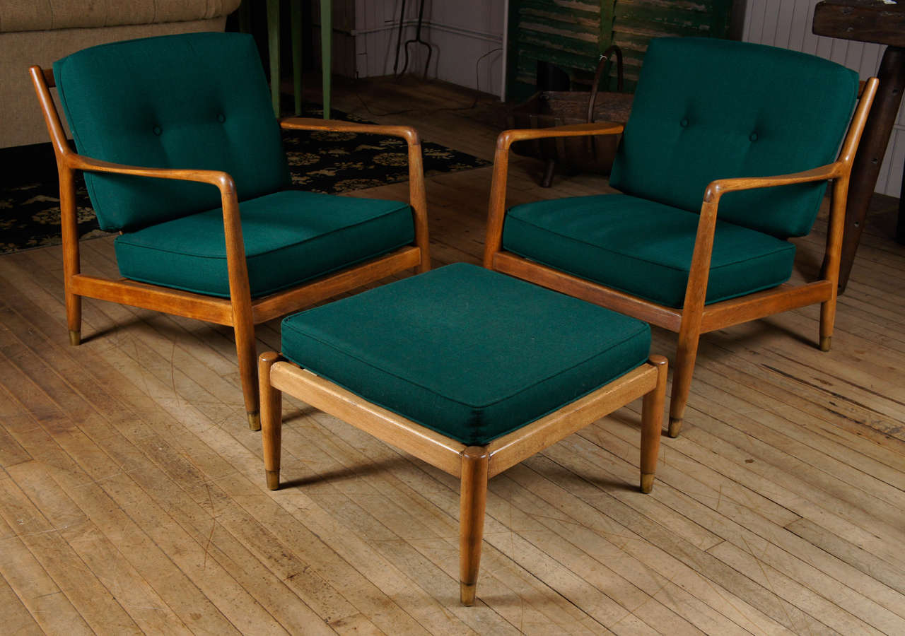 pair of armchairs with ottoman - made in sweden - in walnut - brass tipped legs / ottoman measures 22.5
