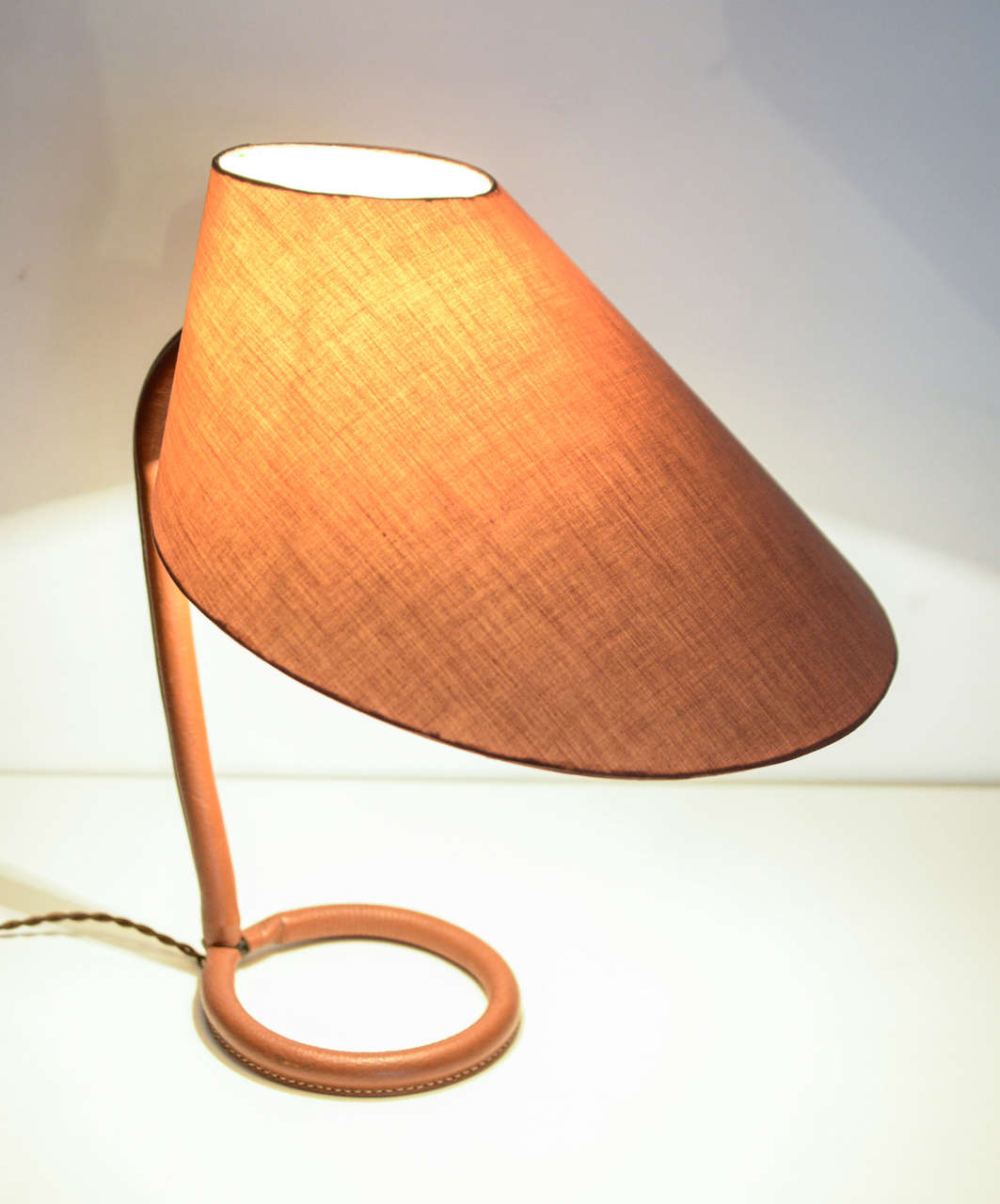 Original table lamp by Jacques Adnet, 1950's
covered with Brown leather 