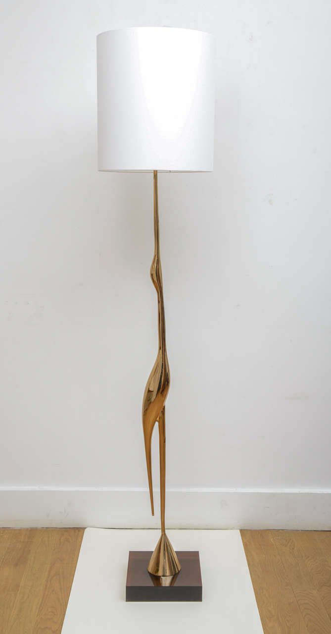 Gilt polished bronze “crane” floor lamp, circa 1970, by René Broissand (1928-) 
Square brown lucite base.
Bird height 135 x 11 cm.
A pair is available.