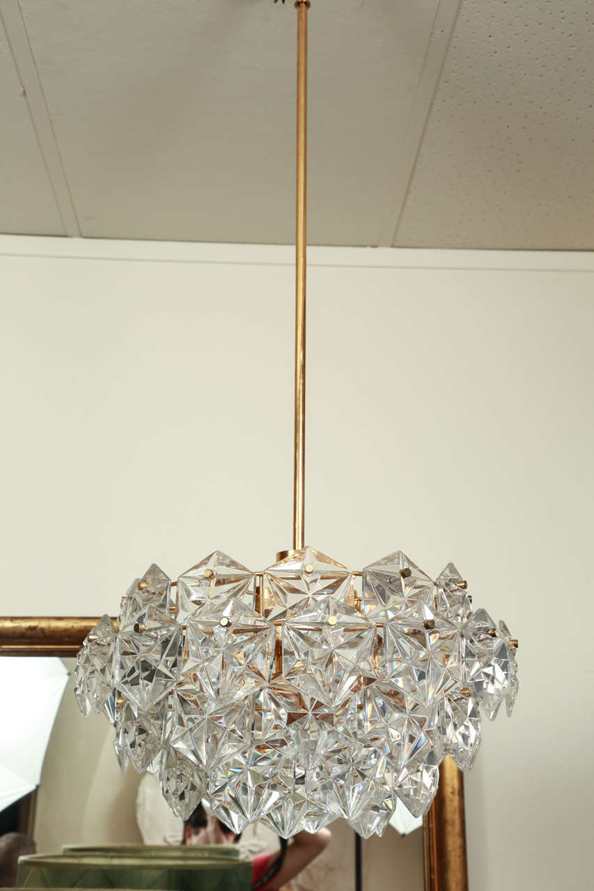 Very nice chandelier by Kinkeldey. The crystal elements are faceted hexagons.  There are seven light sources. It is newly rewired and is outfitted with a rod and canopy, which may be shortened to your specifications.