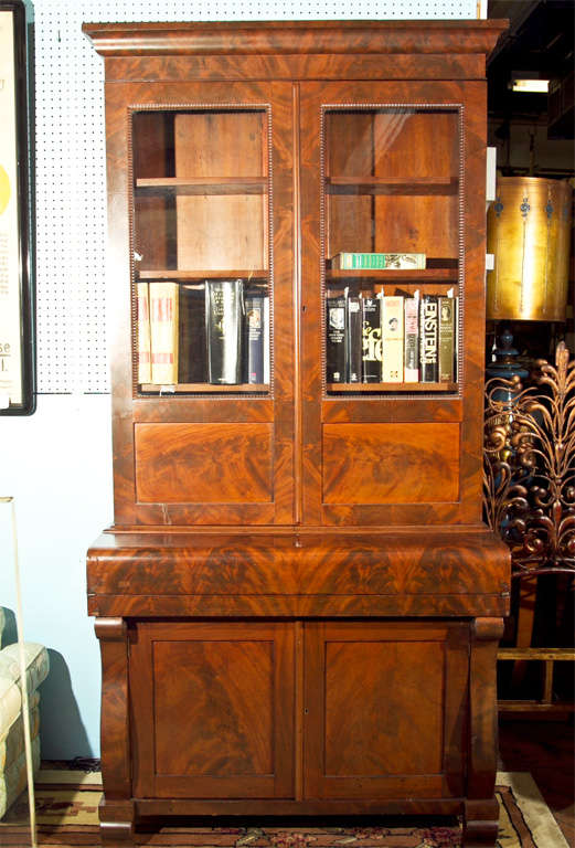 AMERICAN EMPIRE BOOKCASE/ SERCERTERY- PROBABLY OHIO, CROUCH MAHOGANY WITH PINE SECONDARY WOOD-FOUR TOP SHELVES WITH RATCHERT SUPPORTS. ROLL OVER DESK TOP WITH WRITING SURFACE AND DRAWERS INSIDE- ORIGINAL GLASS DOORS