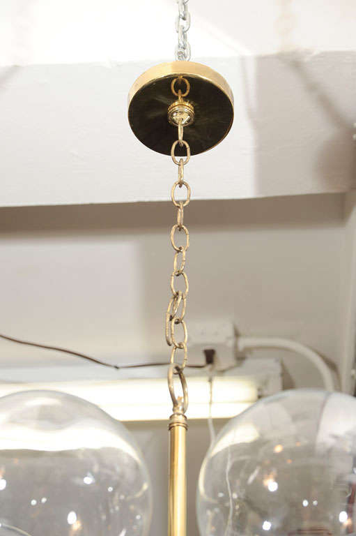A classic Mid-Century chandelier created in Italy features five fine handblown glass globes mounted on a brass and black metal frame.<br />
Presently wired for Euorpean use.<br />
<br />
Reduced From: $2750