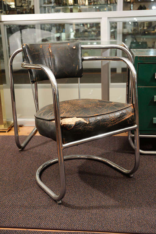 A very rare desk and chair, designed by K.E.M. Weber circa 1930s. The chair features a continuous tubular chrome base, with leather upholstered seat and back. The desk also features a base made of one continuous chrome tube, with forest green