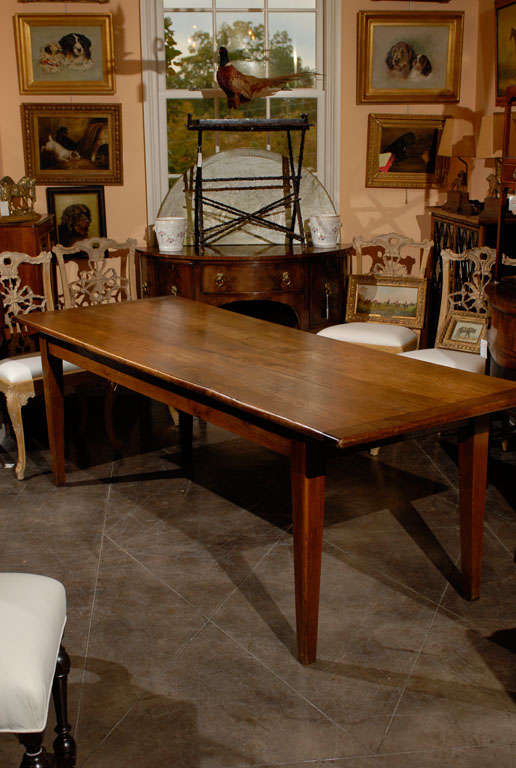 Long French Elm farm table with cleated ends and good overhang on each end for seating comfort.