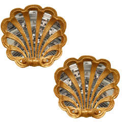 A Pair of Mirrored Shell Form Wall Decorations
