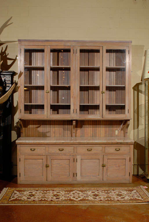 Interesting Cabinet coming originally from an apothecary store in France then rebuilt for a kitchen
It includes a credenza with an italian stone
And a top with original glass doors and hardwares
The shelves are 14 inches deep